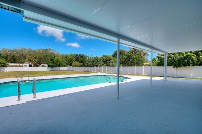 Building Photo - Rare Luxury Lease Opportunity | Spectacular 5-Bedroom Pool Estate on Nearly ¾ Acre Near Gulf Beaches