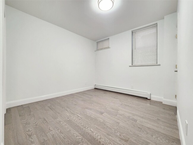 Building Photo - 76-12 Woodside Ave