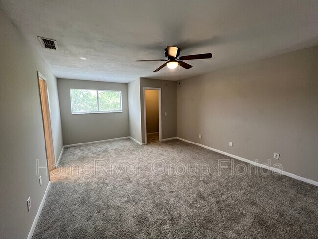 Building Photo - 8745 Whispering Pines Dr