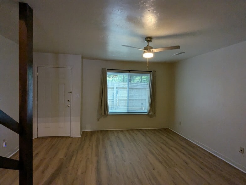 Living room..door and large sliding window to Miccosukee side fenced in patio/yard - 566 Teal Ln