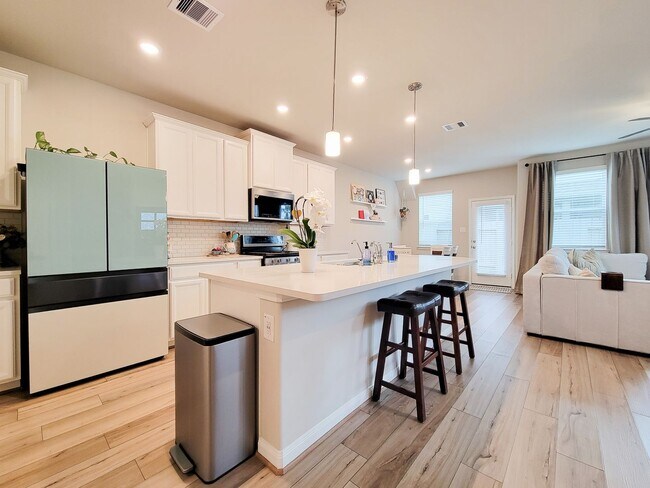 Building Photo - A true gem on a quiet corner lot, this spacious and sun-filled home is tucked away from street no...