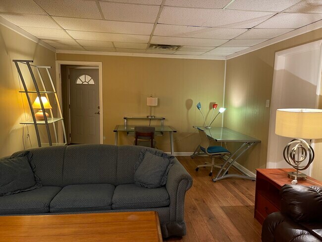 Living room with desks, book shelf. Love seat with end tables not shown. - 604 S Oakwood Ave