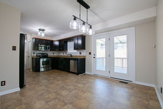 Building Photo - Pet Friendly Three Bedroom with Bonus!