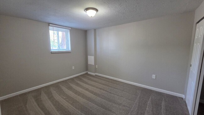 Building Photo - 4 Bedroom 2 Bath with Finished Basement and Study!