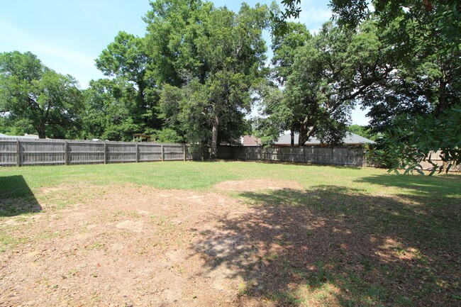 Building Photo - "Spacious 3-Bedroom Brick Home with Fenced...