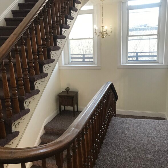 Other antique visual elements enliven the broad landing on the way to your apartment - 1901 E Lombard St