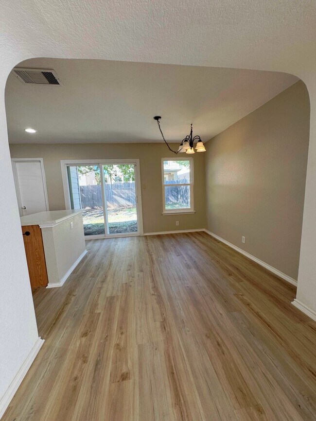 Building Photo - NEW PAINT, FLOORING, APPLIANCES & ROOF  | ...