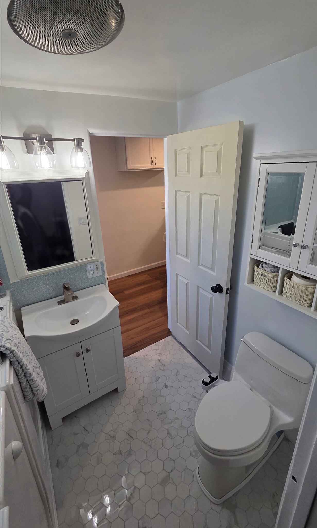 Bath 1 - view toward sink, vanity , toilet - 16825 S Berendo Ave