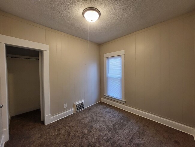 Building Photo - Two bedroom home with partially fenced yard!