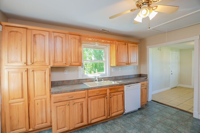 Building Photo - Charming 4-Bedroom Home with Hardwood Floo...