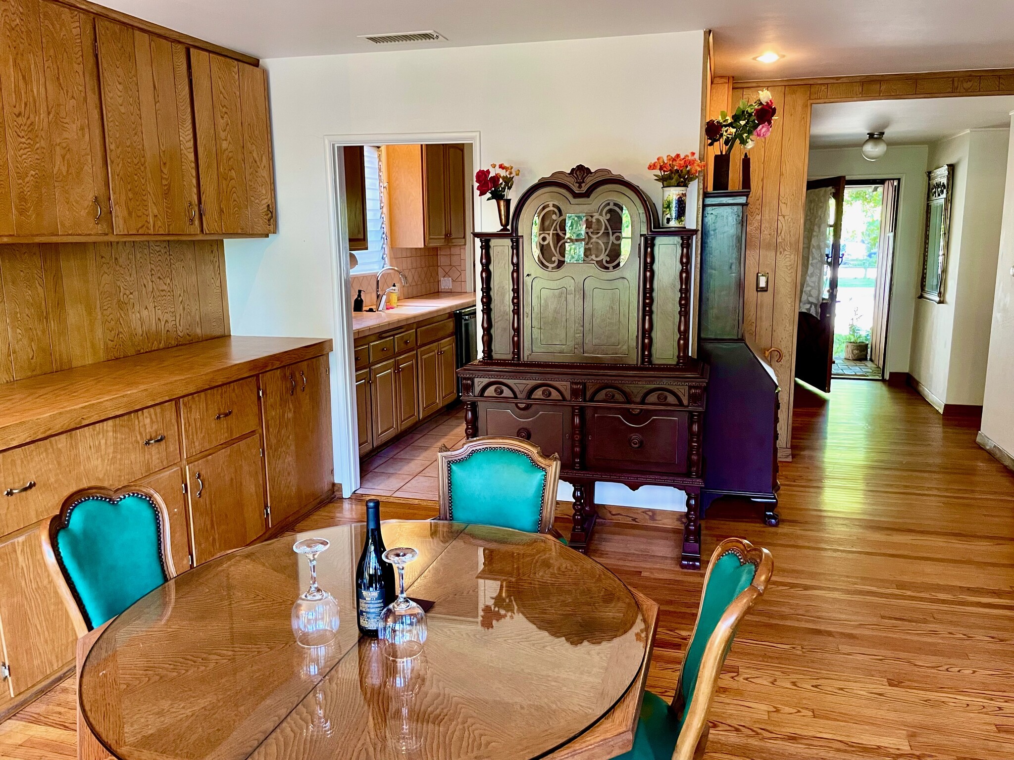 The front entry and kitchen lead into the dining room that looks onto the cascades of the backyard. - 11449 Woodbine St