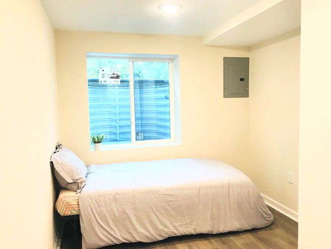 Bedroom #5 with large egress window, lots of natural light - 4806 Cherokee St