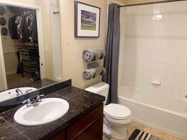 Bathroom is is accessible from the entrance/kitchen area and also from the bedroom so guests do not - 3101 Blake St