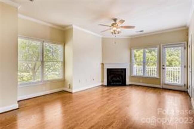 Building Photo - Wonderful craftsman style end-unit townhome
