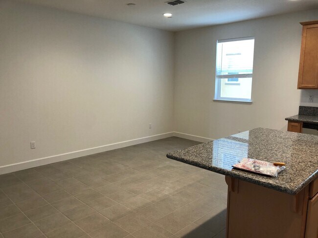 Primary Photo - Tri-level Townhome with 2 Car Attached Gar...