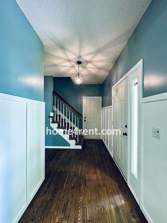 Building Photo - Blue Valley Schools w/ Wood Floors, Finished Basement and a Peaceful, Private Fenced Yard!