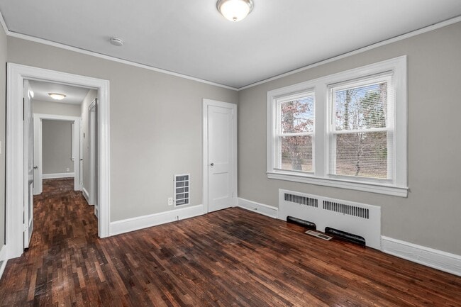 Building Photo - SW, Large Brick Two Bedroom PLUS Two Sun-Rooms, Hardwoods, LR & Separate DR, Fire Place!