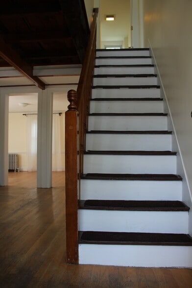 Stairs in living room to upstairs - 7 Allen Ct