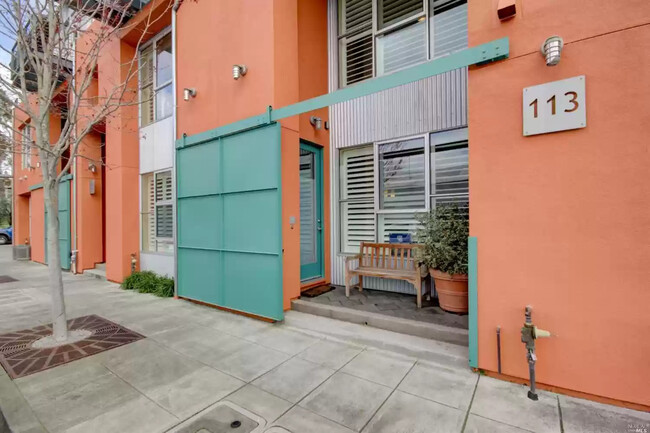 Front entrance with sliding gate. - 113 F St