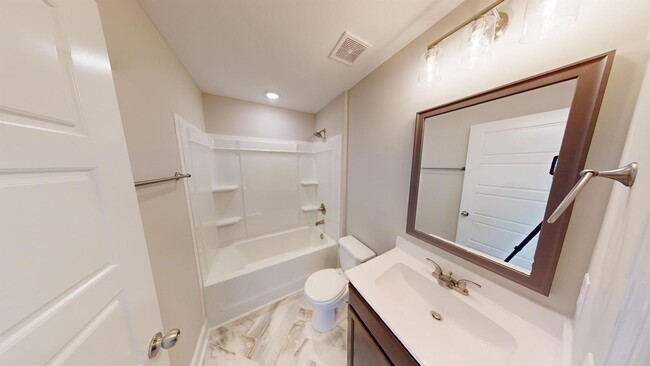 Building Photo - Stylish Home with Feature Stone Front Fireplace, Open Layout and Premium Upgrades