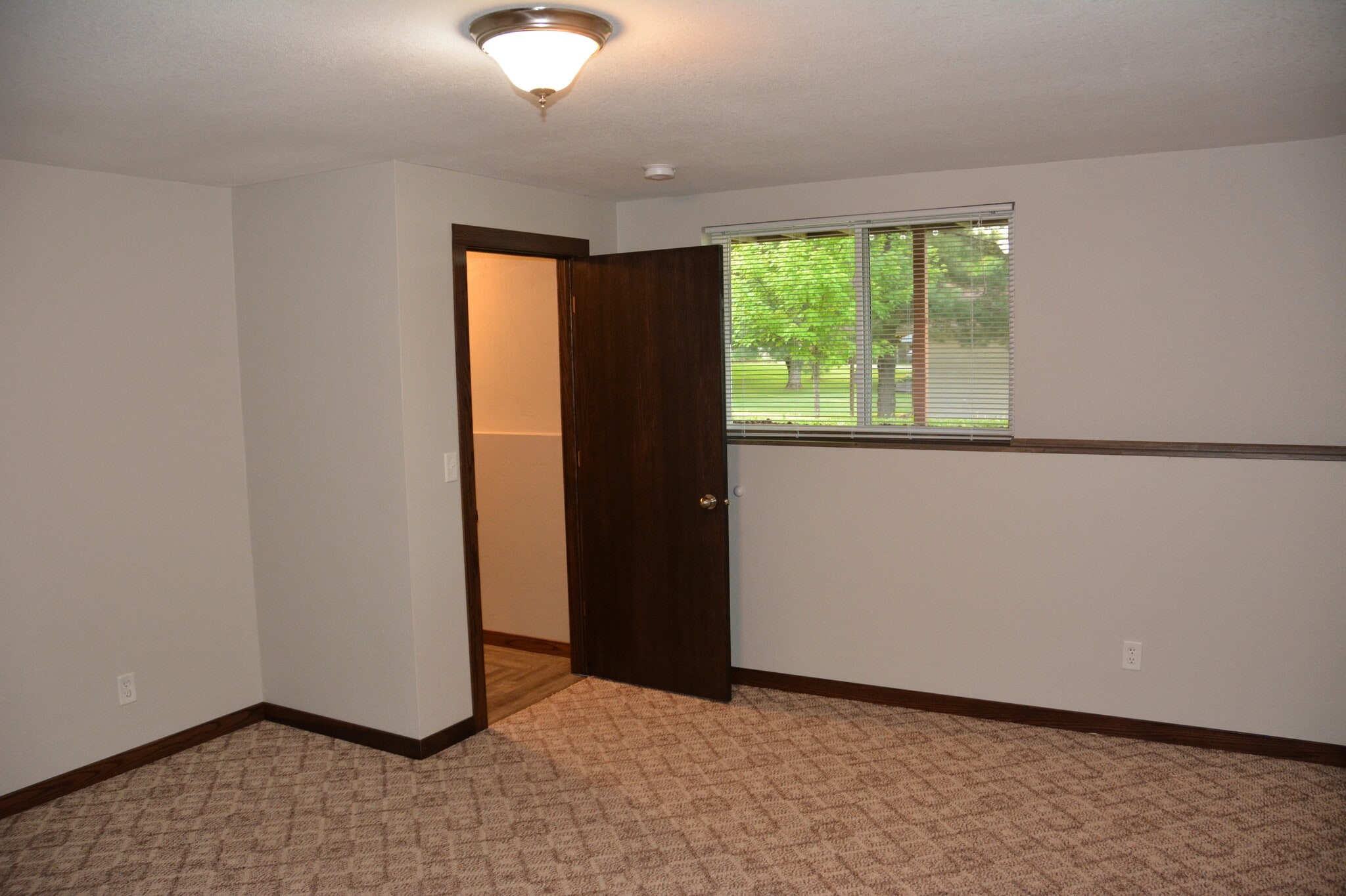Bedroom #3 with natural lighting overlooking back yard - 325 Cordy Lane