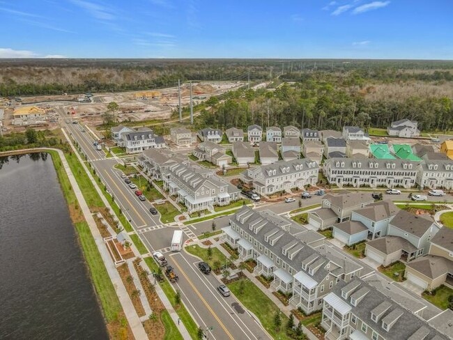 Building Photo - New Luxury Townhome in Celebration, FL Corner unit. All porcelain tiled floors. Aleutian model by...