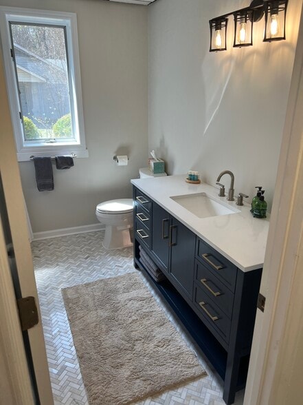 Lower level apartment bathroom includes large tub and washer dryer - 45 Pentland Hills Dr