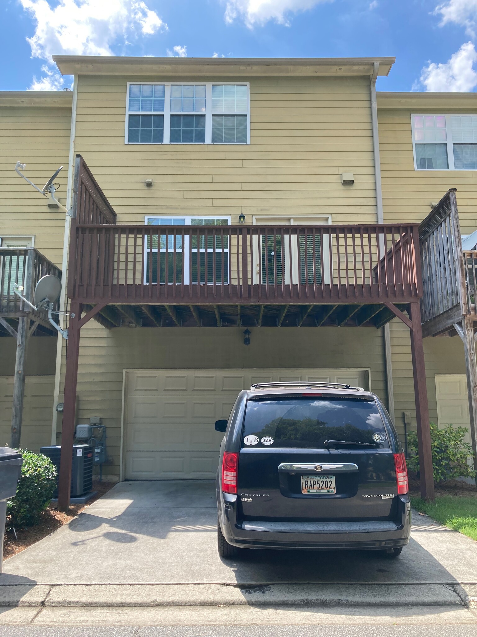 View of the 2 car garage and deck - 1684 Northgate Mill Dr