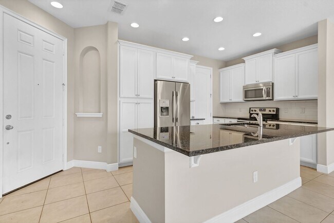 Building Photo - Beautiful 3-Bedroom Townhome in Gated Eagle Creek Golf Community – Lake Nona