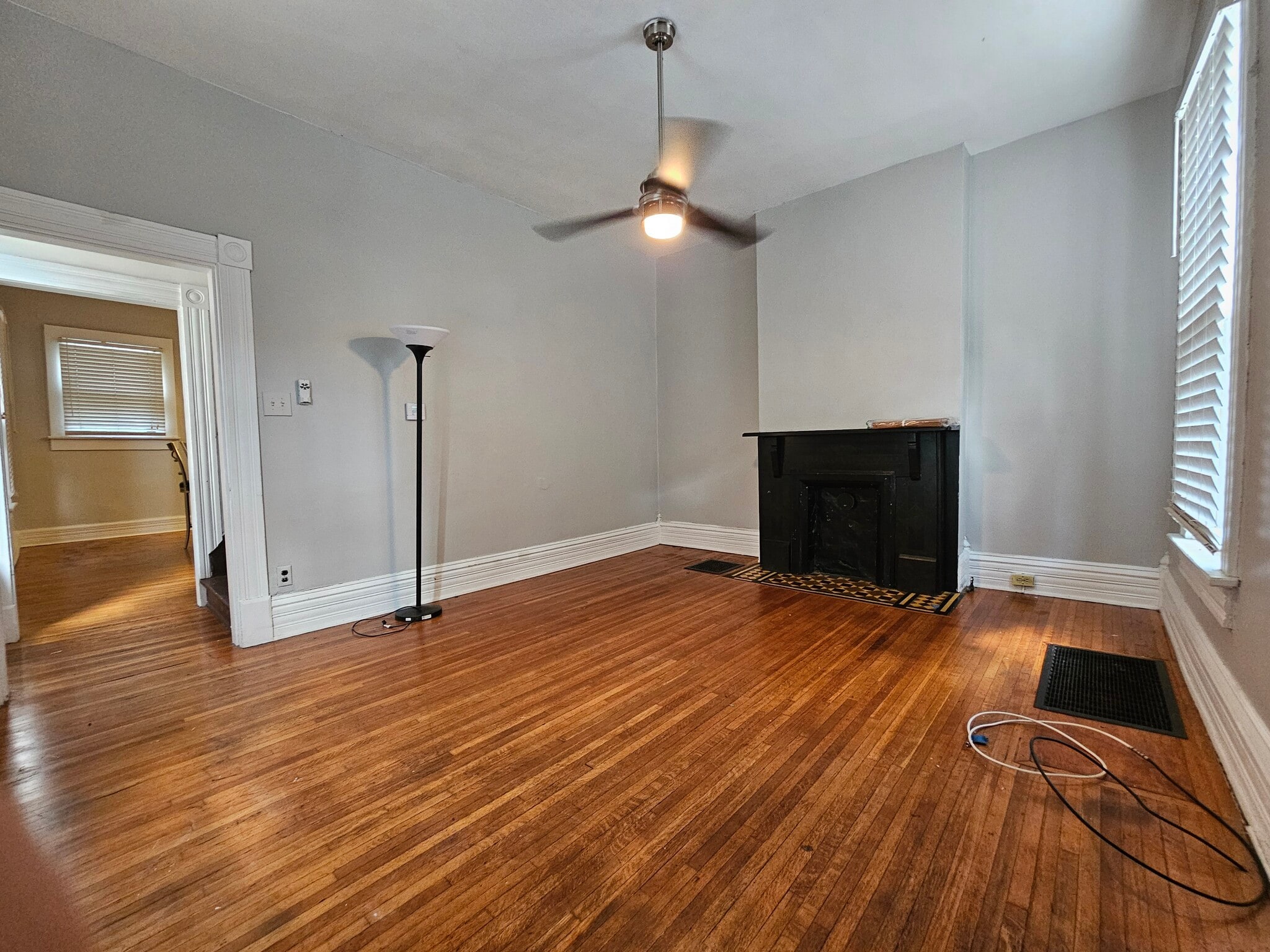Modern ceiling light/fan and original wooden floors - 943 Highland St