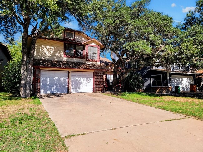Building Photo - Warm & Inviting 4BR / 2.5BA Home with Covered Deck and 2-Car Garage