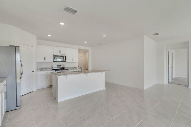 Building Photo - 4 bedrooms and 2 bathrooms, the spacious 1,828 sq ft home features an open concept with a 2 car g...