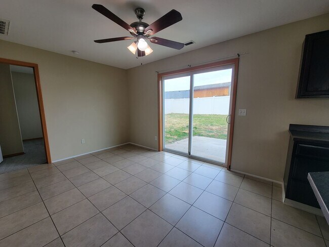 Building Photo - Comfortable 4-Bedroom Home with Fenced Bac...