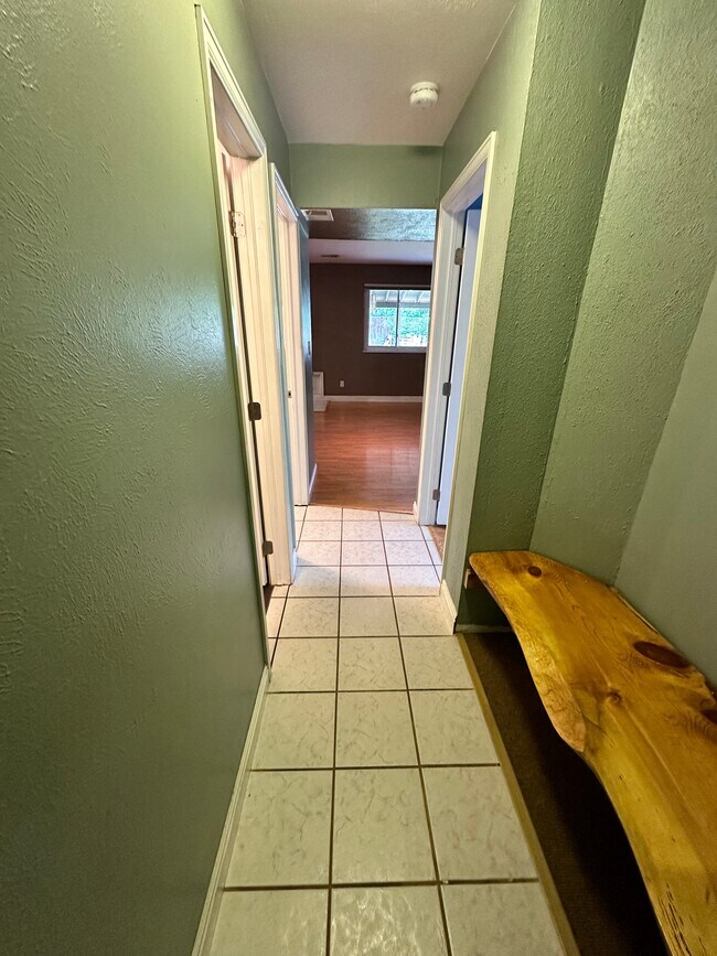 Entry from the garage with custom mudroom bench/storage area - 7393 S Washington Cir