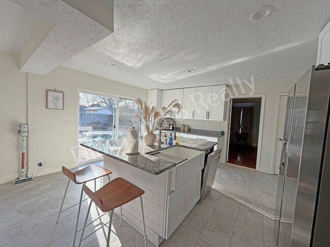 Building Photo - Stunning 3_Bed Home with Two Primary Suites & a Pool!