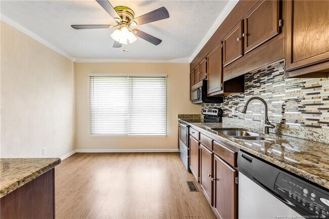 Building Photo - 6837 Woodmark Dr