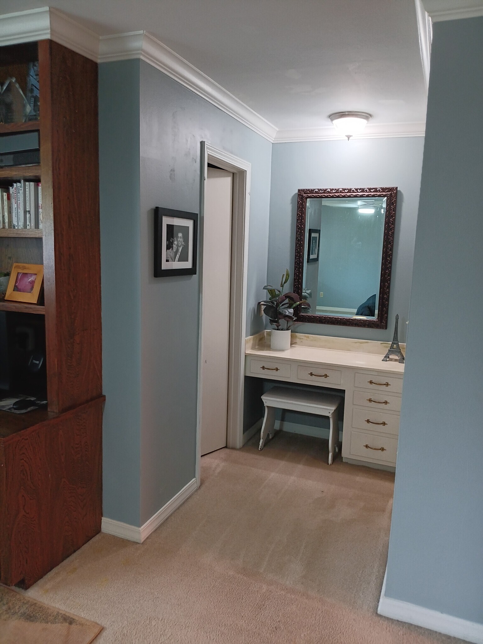 Primary bedroom built-in vanity. Walk in closet to the left and bathroom to the right. - 2308 Wesley Cir