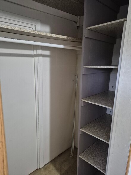 Den/office space closet shelves - 501 Beatty Rd