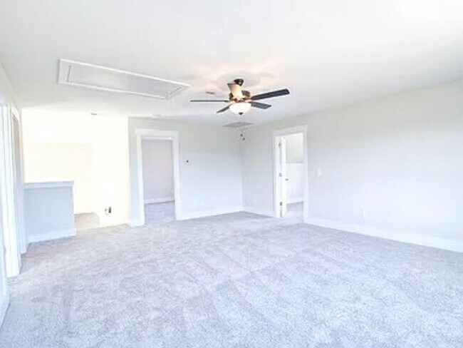 Building Photo - Situated on over 3 acres right in a growin...