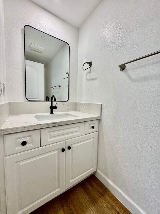 Building Photo - Beautifully Remodel Townhouse with AC & Two Car Garage!
