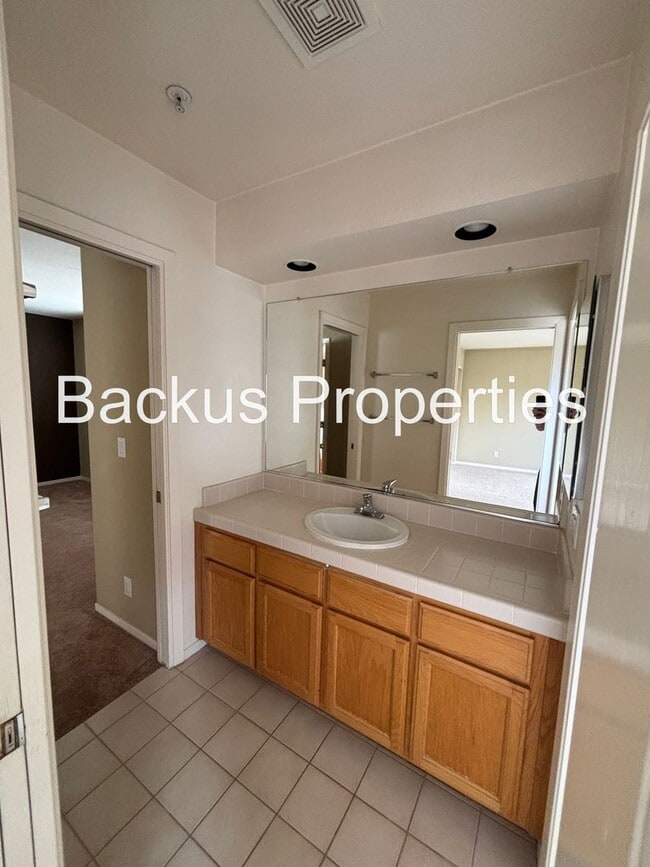 Building Photo - Great two-level home in Las Palmas II with scenic views