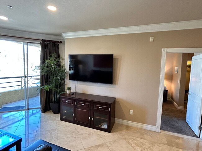Building Photo - Gorgeous fully furnished strip view condo ...