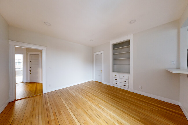 living room with built-in shelving - 40 Orkney Rd