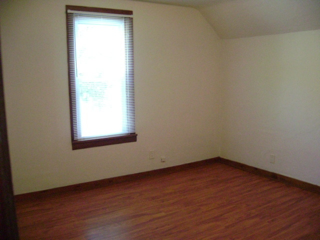 Bedroom with large window - 211 W Eureka St