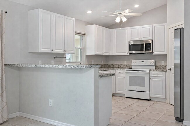 Building Photo - Spacious Three-Bedroom Home with Open Floor Plan, Large Yard & Screened Patio