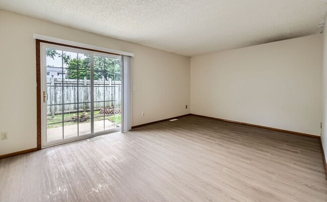Building Photo - Spacious 3 - Bedroom Townhome with Modern Updates & Private Green Space.