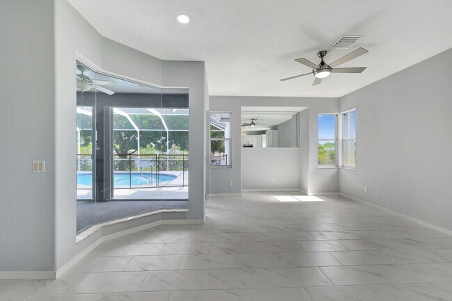 Building Photo - A BOATER'S PARADISE WITH THIS STUNNING 3 BEDROOM, 2 BATH WATERFRONT POOL HOME W/DOCK & BOAT LIFT ...