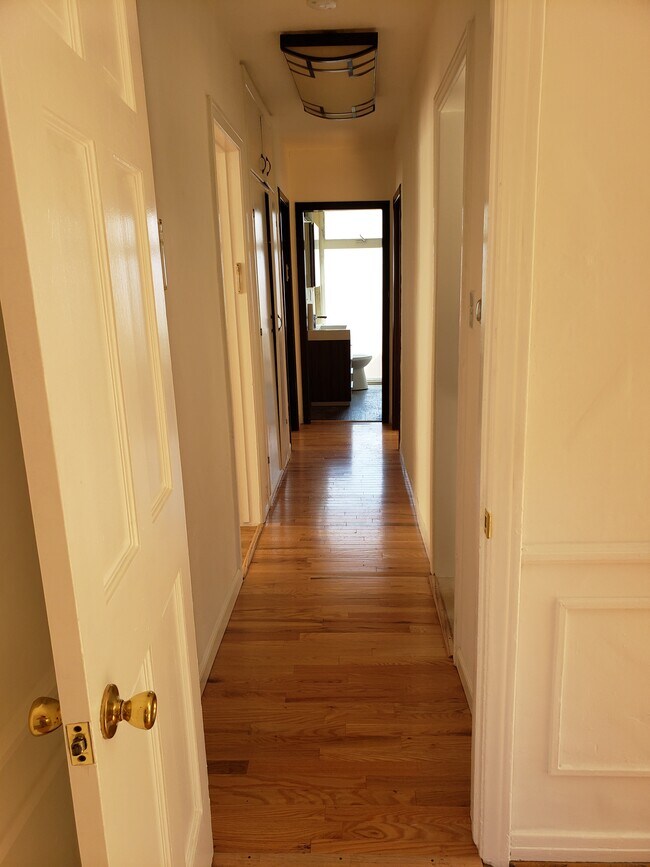 Hall to bedrooms and rest rooms - 466 S Wetherly Dr