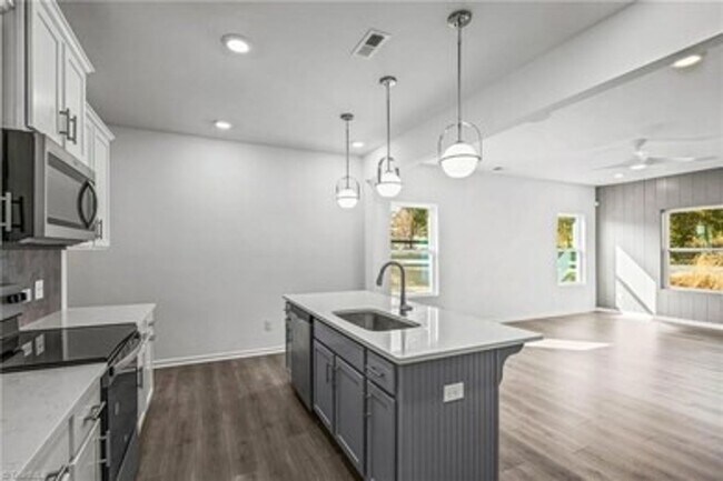Building Photo - Spacious 3-Bedroom Townhome with Private Patio, Central HVAC & In-Unit Laundry Hookups