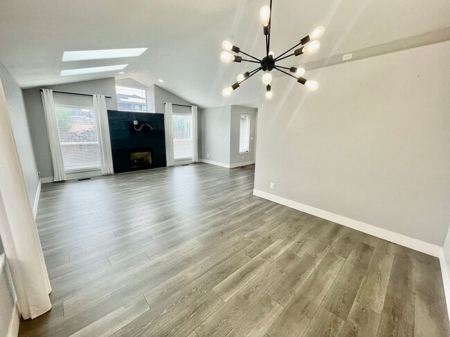 Building Photo - **$500 Move in Credit** 3 Bed/2 Bath Home.  Fresh and Modern Interior.  A/C, Garage, and Fenced Y...